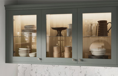 The Tydeman kitchen, featuring shaker style cabinets in muted, earthy green.