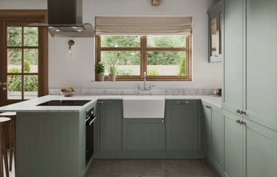 The Tydeman kitchen, featuring shaker style cabinets in muted, earthy green.