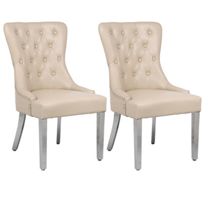 A Pair Cream leather Aire Tuffted Metal Knocker Back Dining Chairs with