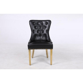 A Pair of Leather Aire Dining Chairs with Golden Legs in Black