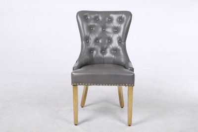 A Pair of Leather Aire Dining Chairs with Golden Legs, Knocker & Studs in Grey