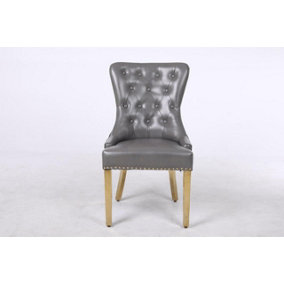 A Pair of Leather Aire Dining Chairs with Golden Legs, Knocker & Studs in Grey