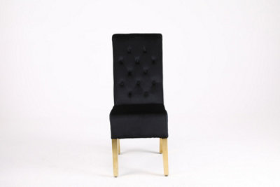 A Pair of Velvet Dining Chairs with Golden Legs in Black
