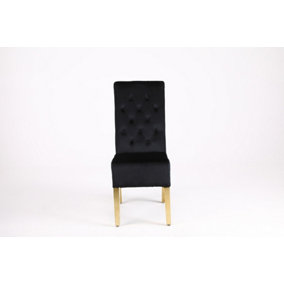 A Pair of Velvet Dining Chairs with Golden Legs in Black