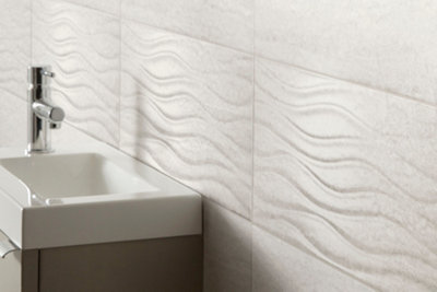 White 3D bathroom tiles with curved detailing.