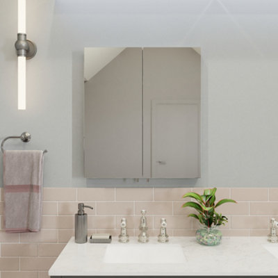 A double-door mirrored bathroom cabinet installed above a basin.