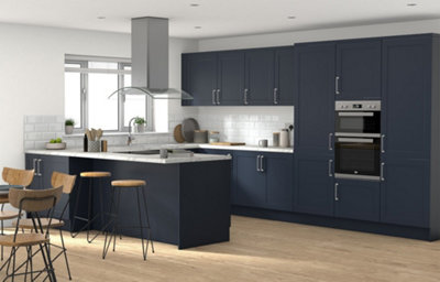 Artemisia midnight blue kitchen shaker with integrated oven with white marble worktops.
