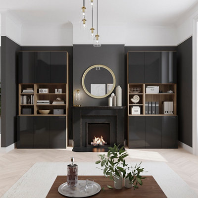 Large black living room with light wooden flooring and modular Atomia storage units fitted into alcoves on either side of the chimney breast.