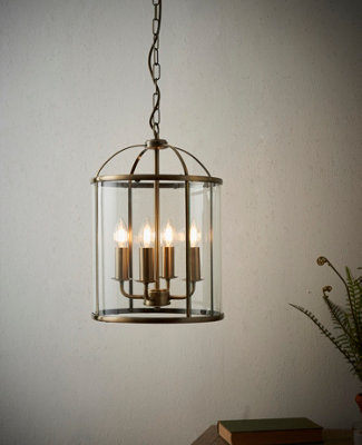 Anson Lighting Powell 4lt Pendant light finished in Antique brass plate and clear glass