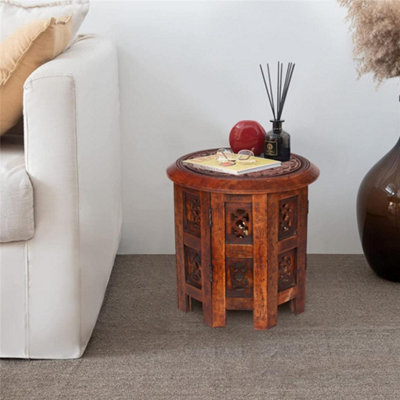 Round carved wood on sale coffee table