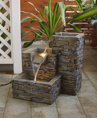 Aqua Creations Stone Pouring Columns Mains Plugin Powered Water Feature with Protective Cover