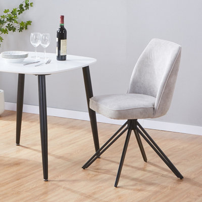 Aspen Pair Of Swivel Dining Chairs In Light Grey Cord Fabric With Black Metal Legs