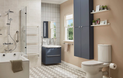 Modern accessible family bathroom in beige, featuring a walk-in shower bath, close-coupled rimless toilet, matt blue wall cabinet and vanity unit, white towel radiator, and chrome accessories.