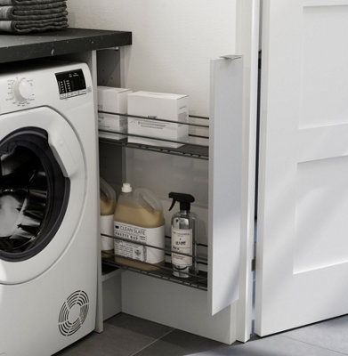 Close up of slim pull out drawer besides a washing machine.