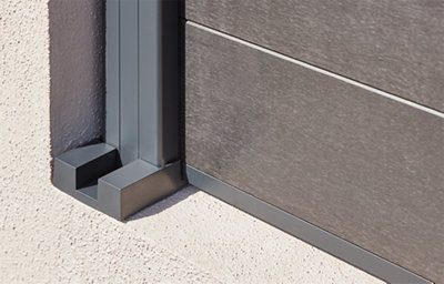 This image shows the fence support post used to instal the neva fence panel. It is zoomed in on the support at the bottom of the post, in a dark grey colour.