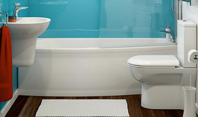 Bathroom space with a shower bath, wall hung semi pedestal basin and a close coupled toilet.