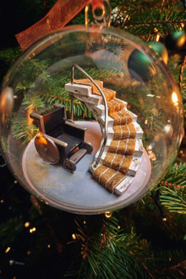 Bauble with a staircase and wheelchair inside it.