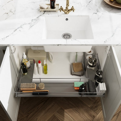 The inside of an under sink cupboard.