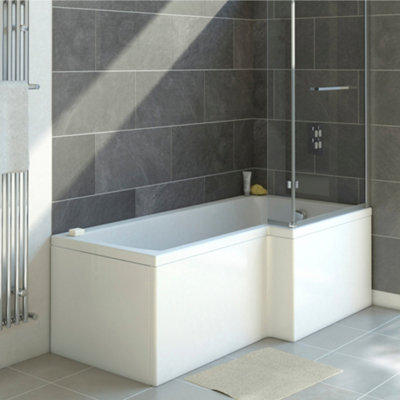 An L-shaped shower bath with a bath screen installed in the corner of a black tiled wall.