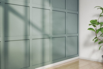 Teal beadboard panelled feature wall in a white room.