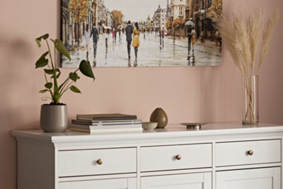 Traditional style white storage unit with 3 drawers at the top and 3 cupboards with doors at the bottom.