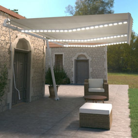 Berkfield Manual Retractable Awning with LED 600x350 cm Cream