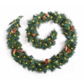 Best Artificial 9ft Colorado Pine Christmas Garland with Pine Cones with 80 warm white battery lights