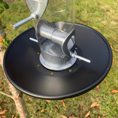 Bird feeder catcher outlet tray