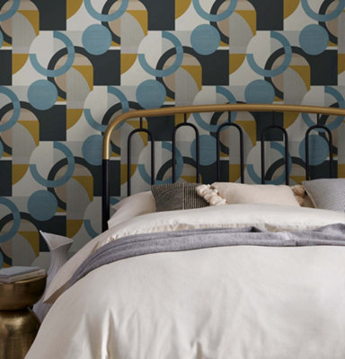 Blue and yellow retro print wallpaper in a bedroom.