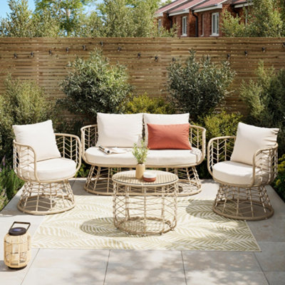 GoodHome Omalos Matt Beige Rattan effect 4 Seater Coffee set placed on a rug.
