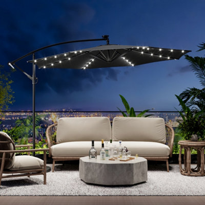 grey patio umbrella with lights WestinTrends 10 ft Outdoor Solar LED Cantilever Base Weights, Dark Green Patio umbrella provides expansive 15ft shade Patioslife Aegis 10ft Round Cantilever