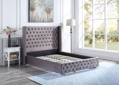 Tall upholstered king deals bed