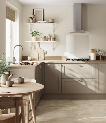 Neutral Scandi kitchen with wooden worktops and stylish cream coloured accessories.