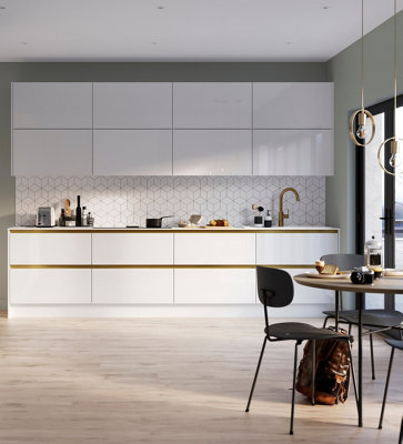 Minimalist white Scandi kitchen with gold effect lights, tap, and handles.