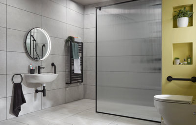 Modern accessible small wet room with a matt black walk-in shower, matt black mixer shower, alpine white d-shaped basin, ceramic stone-effect tiles, and matt black accessories.