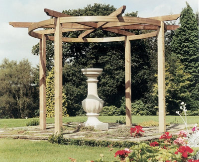 A carousel pergola with gently curved wooden beams, creating a striking focal point in the garden.