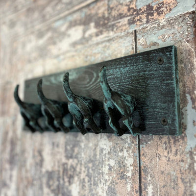 https://media.diy.com/is/image/KingfisherDigital/cast-iron-and-wooden-dog-tail-wall-hooks~5055031306589_01c_MP?$MOB_PREV$&$width=768&$height=768