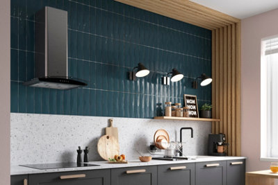 Wooden vertical wall panelling in a kitchen that extends up to the ceiling for a cohesive look.