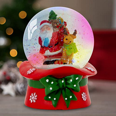 Celebright Christmas Musical Snow Globe - Plays 8 Songs With Changing LED Colours - Large 14cm - Santa & Rudolph on Festive Hat