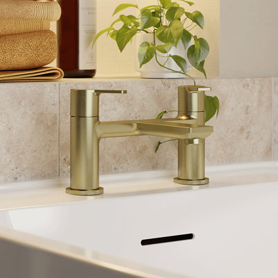 Image of a bath lever tap in gold.