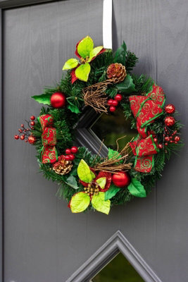 Christmas Wreath With Ribbons Baubles And Poinsettia