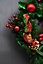 Christmas Wreath With Ribbons Baubles And Poinsettia