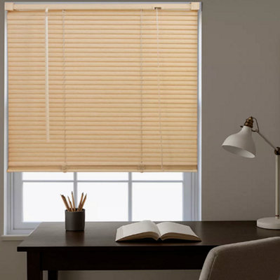 Classic light coloured blinds installed behind a desk.
