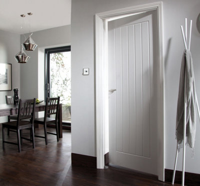 Closed internal door in a bright dining room space.