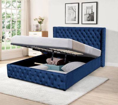 Comfy Living 4ft6 Winged Plush Velvet Ottoman Gas Lift Storage Bed In Blue