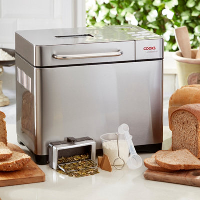 https://media.diy.com/is/image/KingfisherDigital/cooks-professional-digital-bread-maker-machine-19-programmes-breadmaker-crust-control-keep-warm-with-fruit-and-seed-dispenser~5057898004332_03c_MP?$MOB_PREV$&$width=618&$height=618