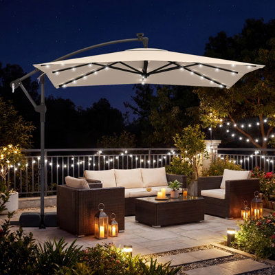 beige patio umbrella with lights HOMSHADE 10FT Solar LED Cantilever Base Included, outdoor umbrella combines reliable sun protection with ambient evening lighting Room & Retreat Solar Patio