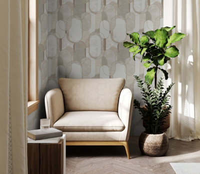 A living room with curved design wallpaper and a cream armchair.