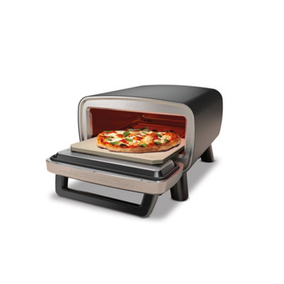 Ninja pizza oven with cooked pizza inside.