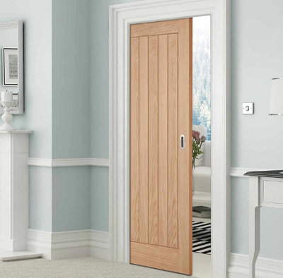 Wooden sliding door in a hallway.